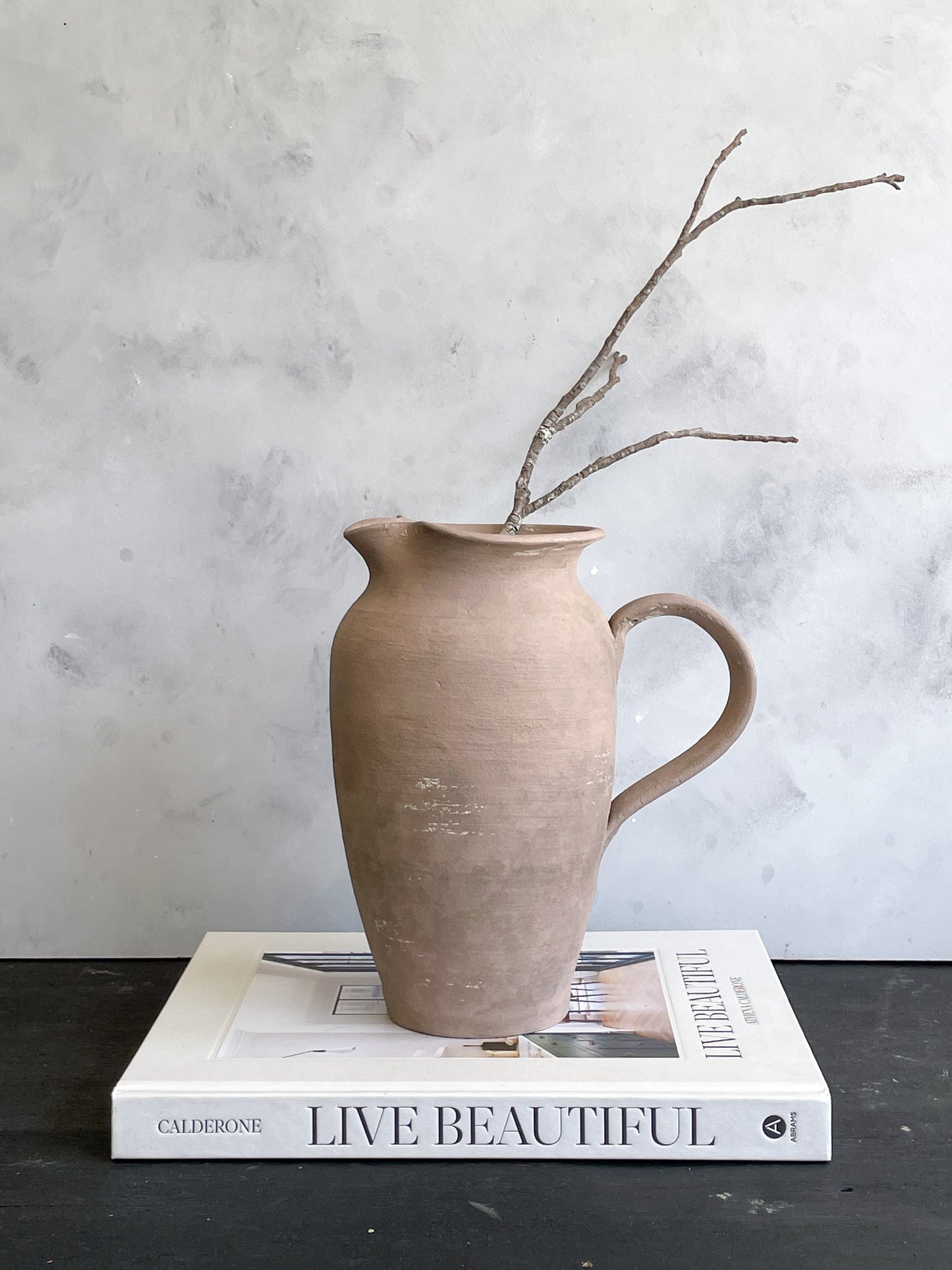 Side view of Earth Collection Ceramic Pitcher Vase with handle