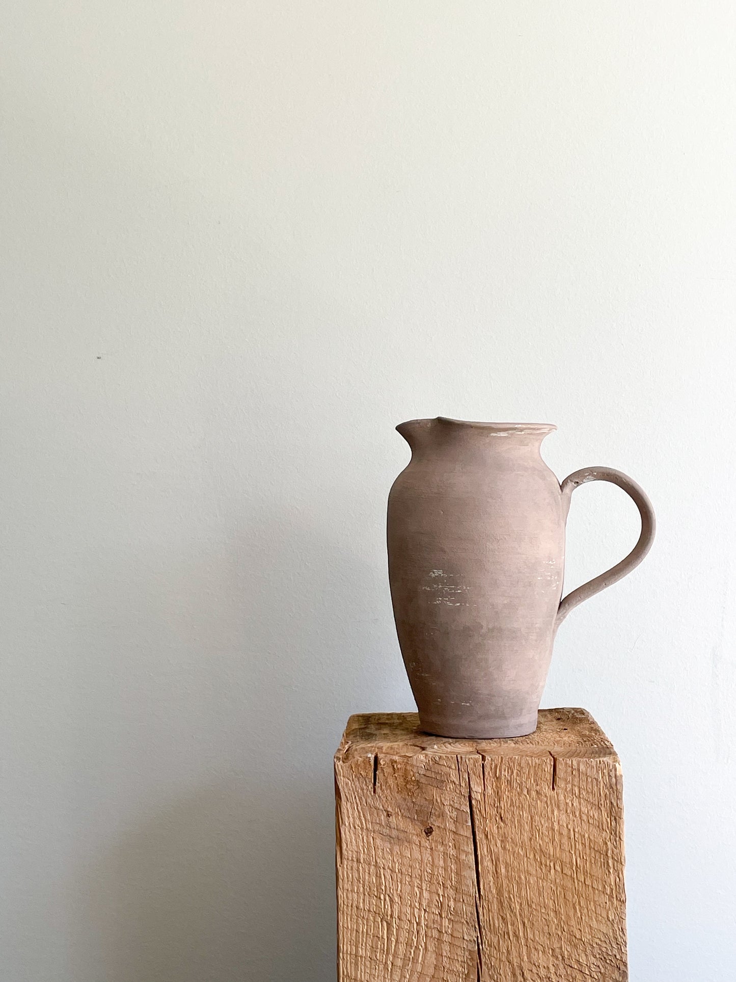 Side view of Earth Collection Ceramic Pitcher Vase with handle