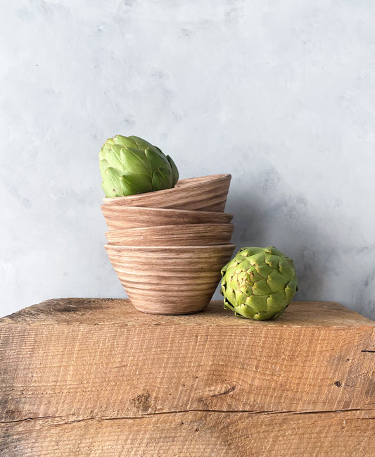 Handmade ceramic decorative bowl in neutral tones.