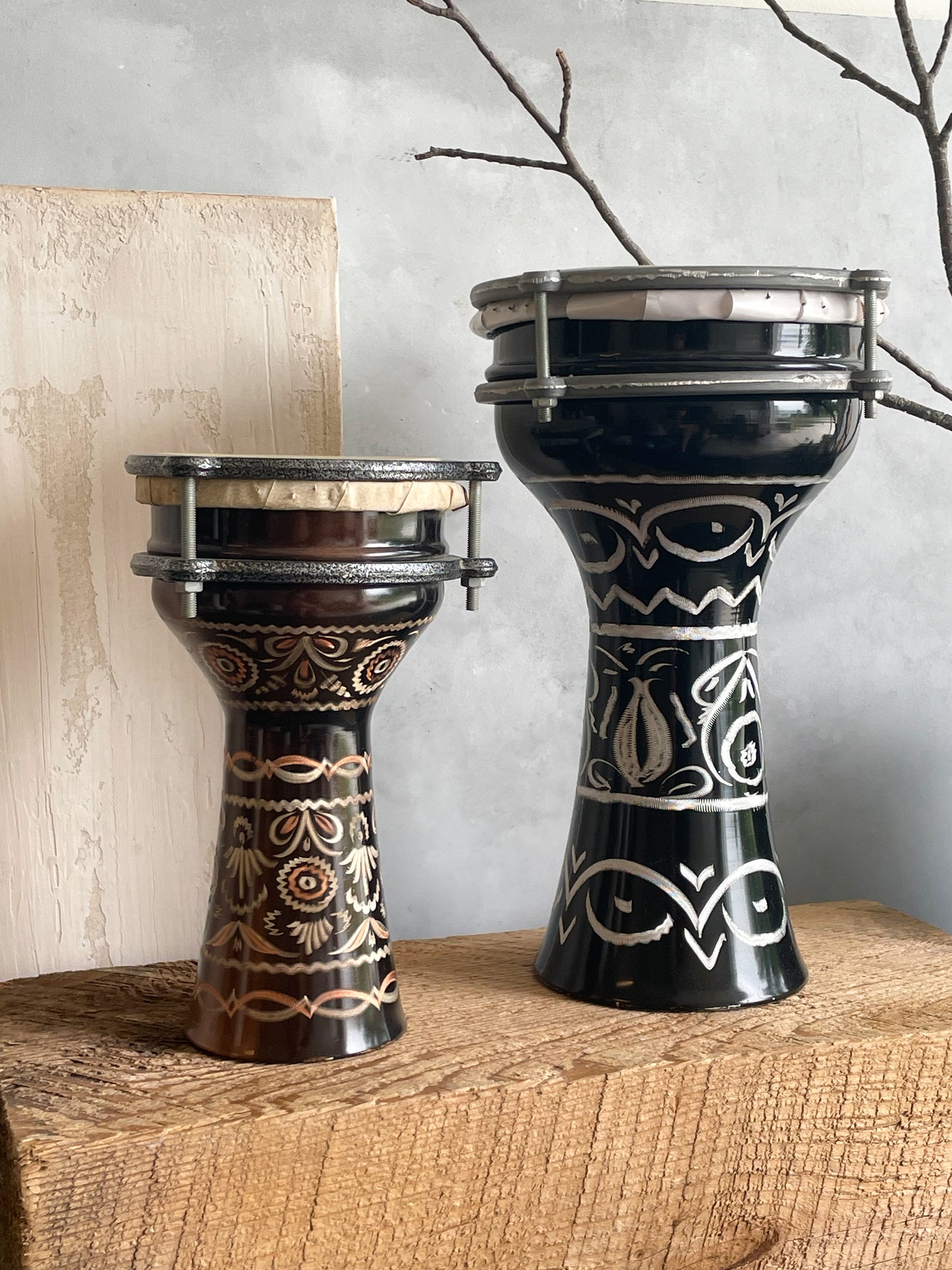 antique pair of etched metal drums