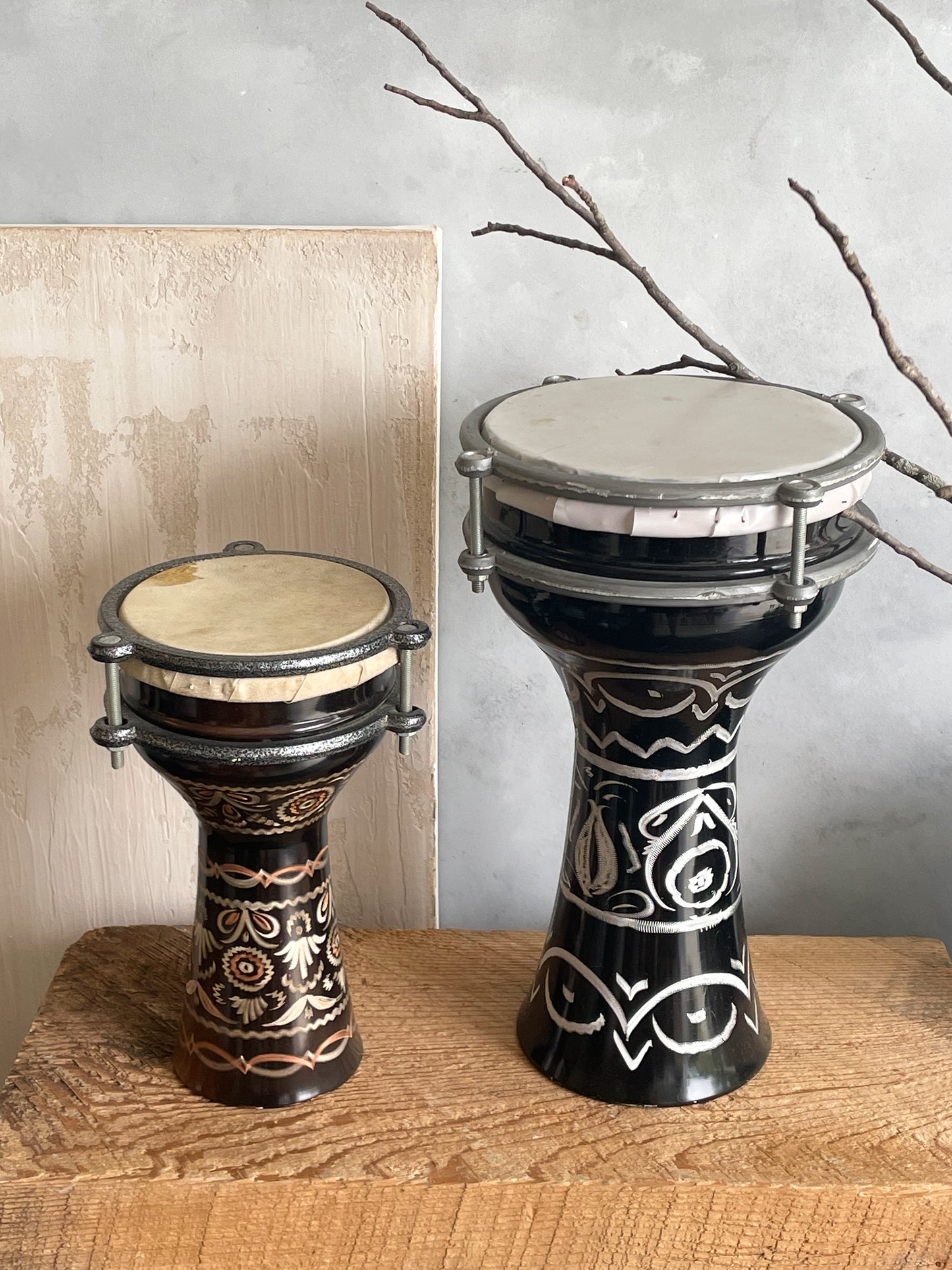 antique pair of etched metal drums