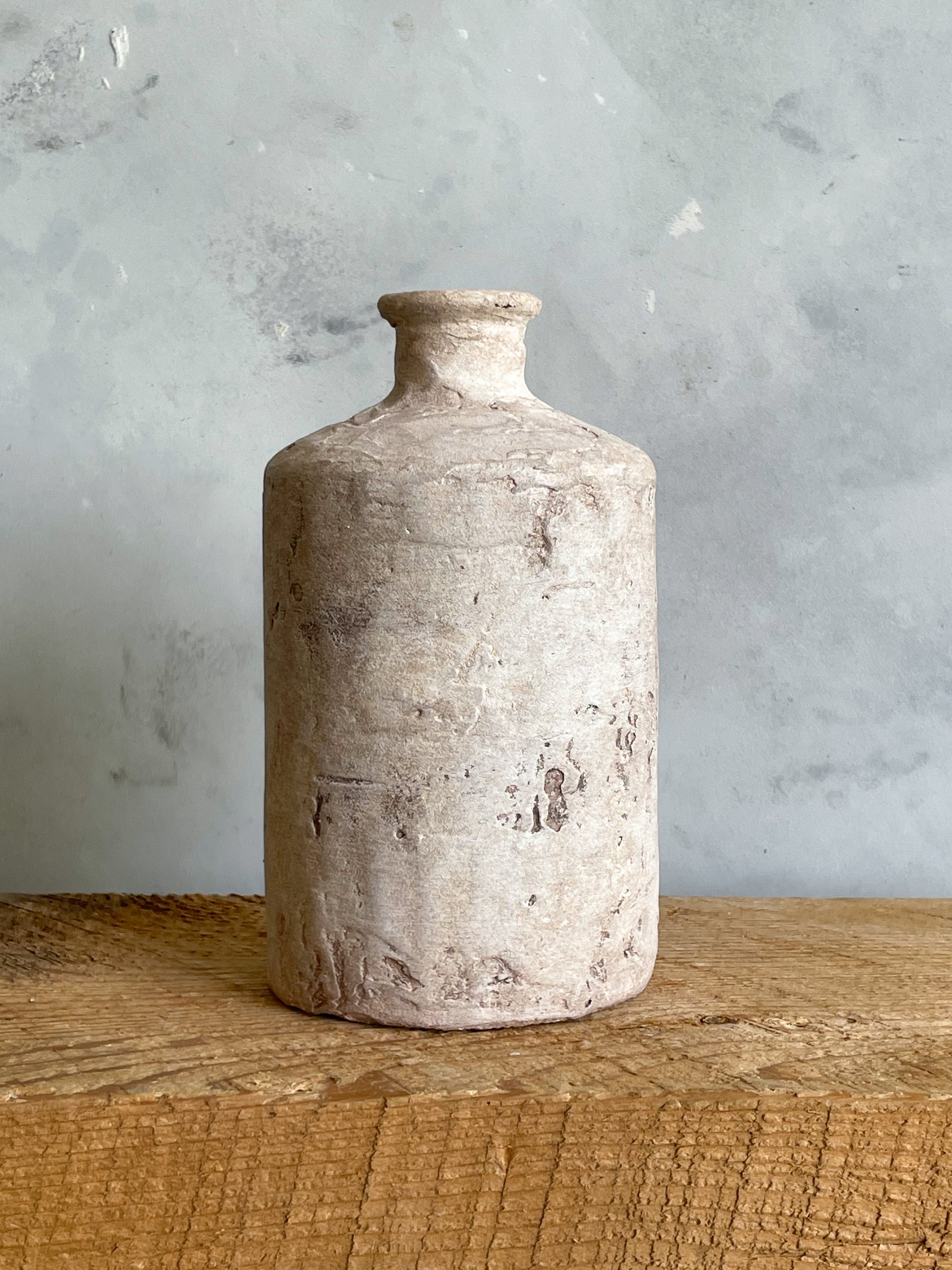 Close-up showing the unique finish of the Milos Collection rustic vase.