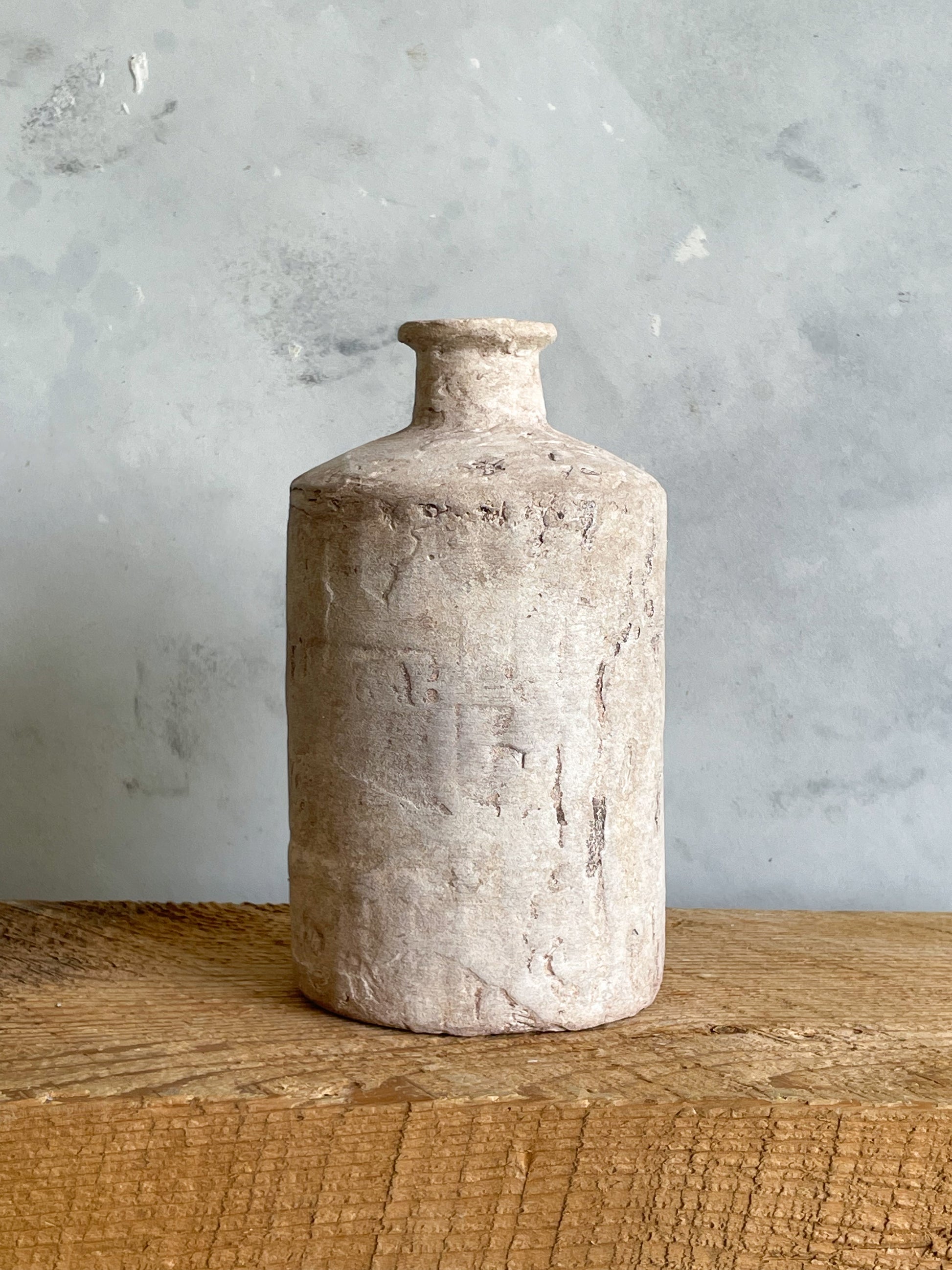 Close-up showing the unique finish of the Milos Collection rustic vase.