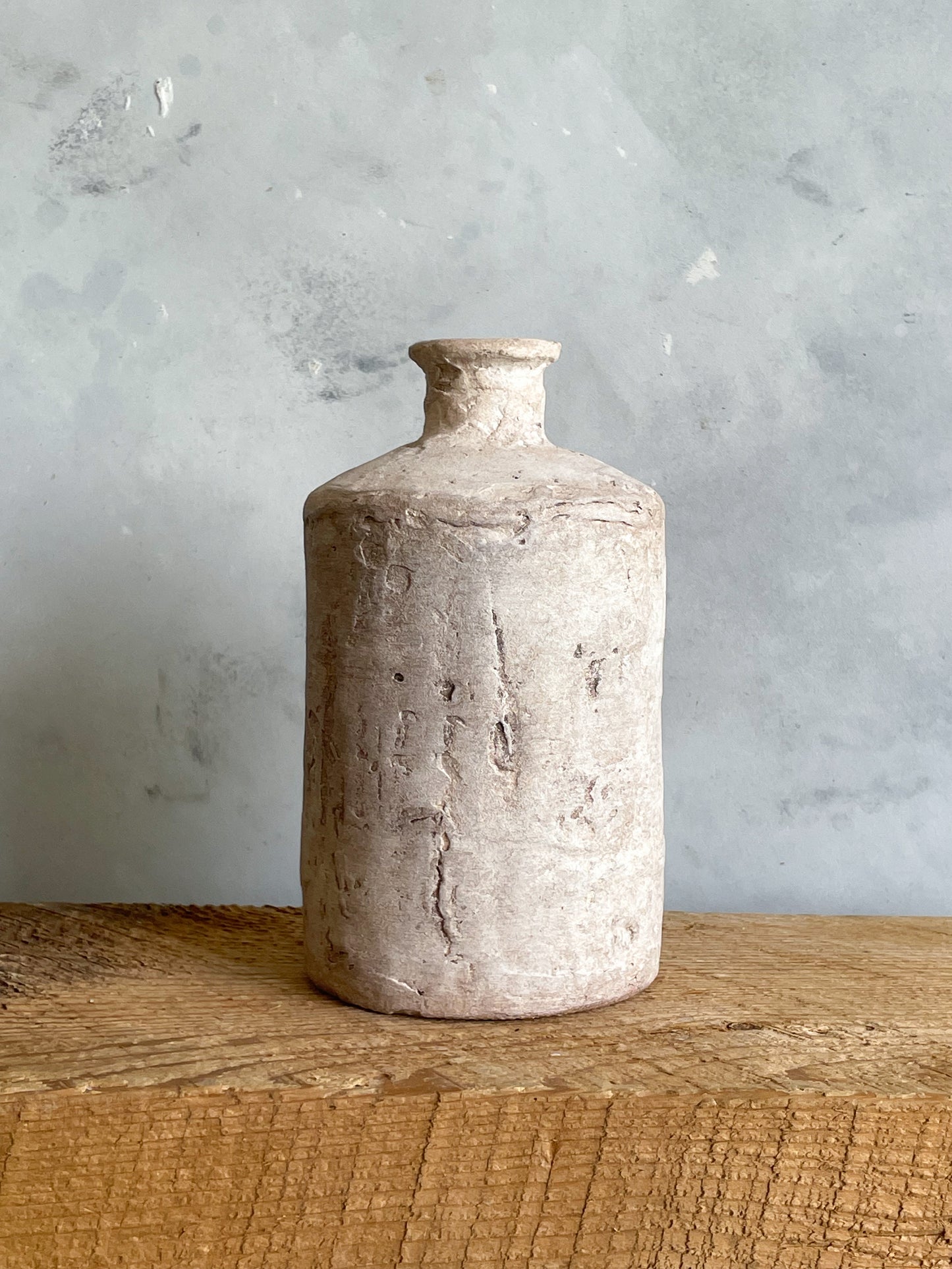 Close-up showing the unique finish of the Milos Collection rustic vase.