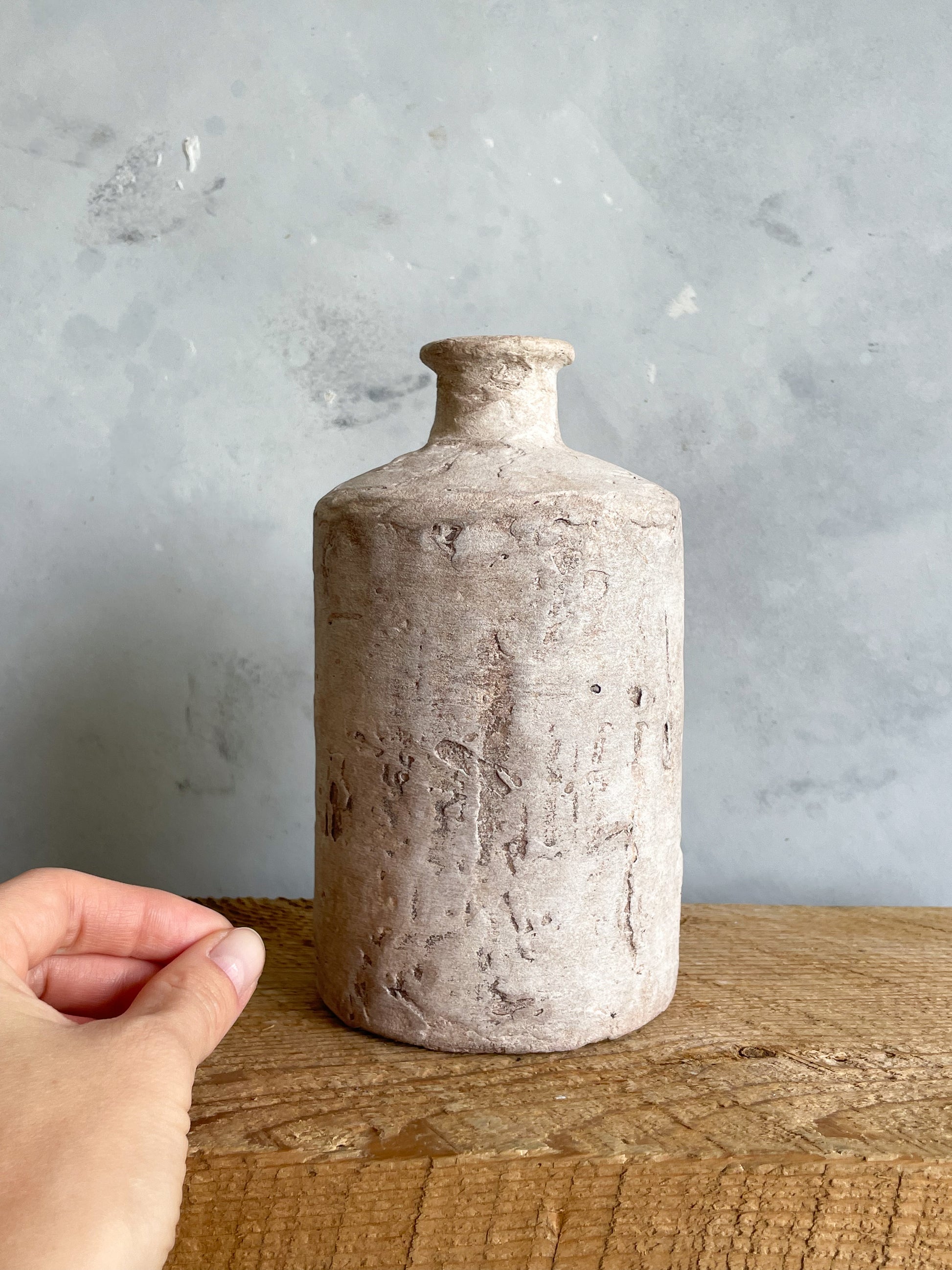 Close-up showing the unique finish of the Milos Collection rustic vase.