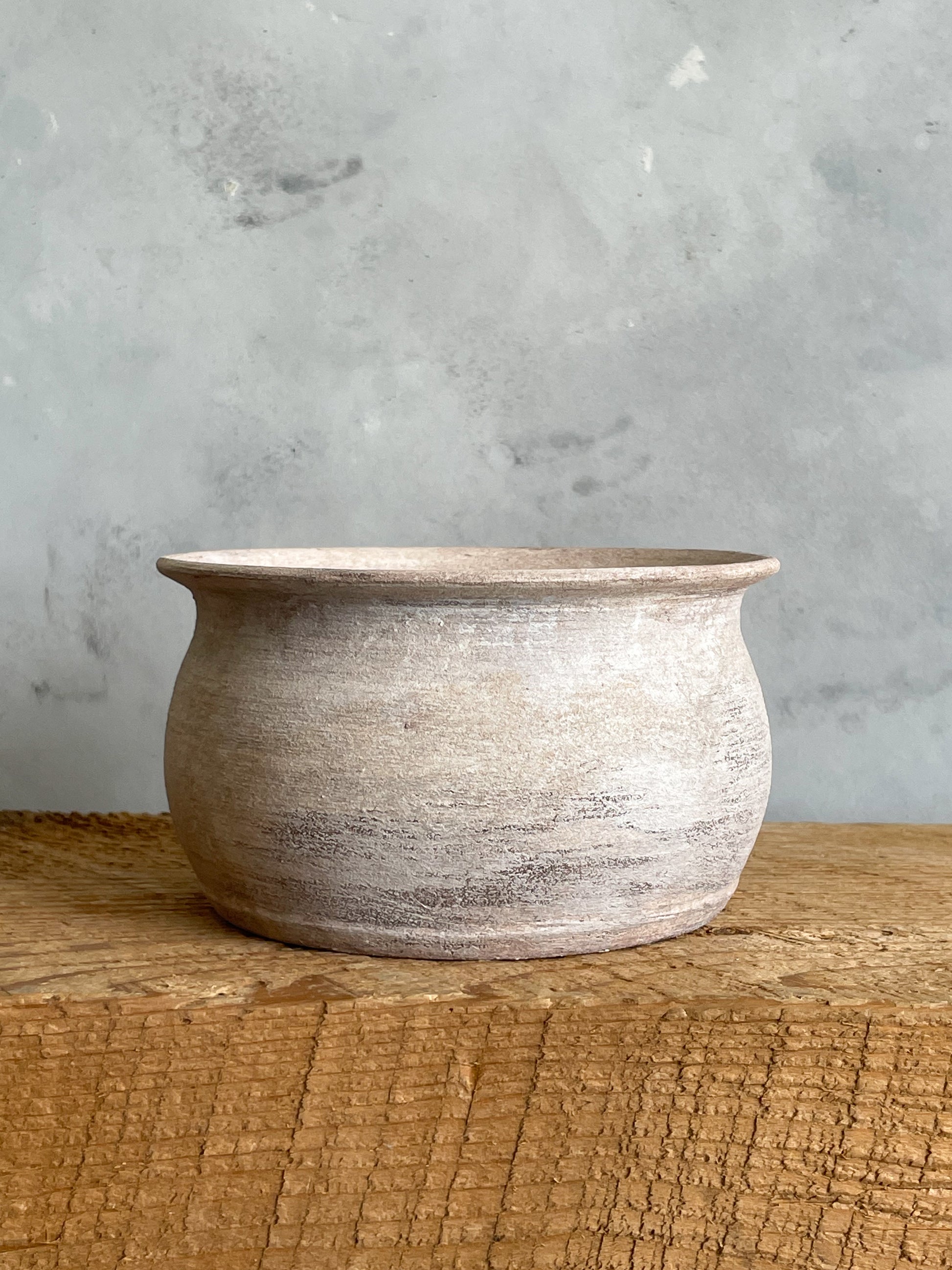 Close-up of Milos Collection rustic white textured planter vase, showing handcrafted details