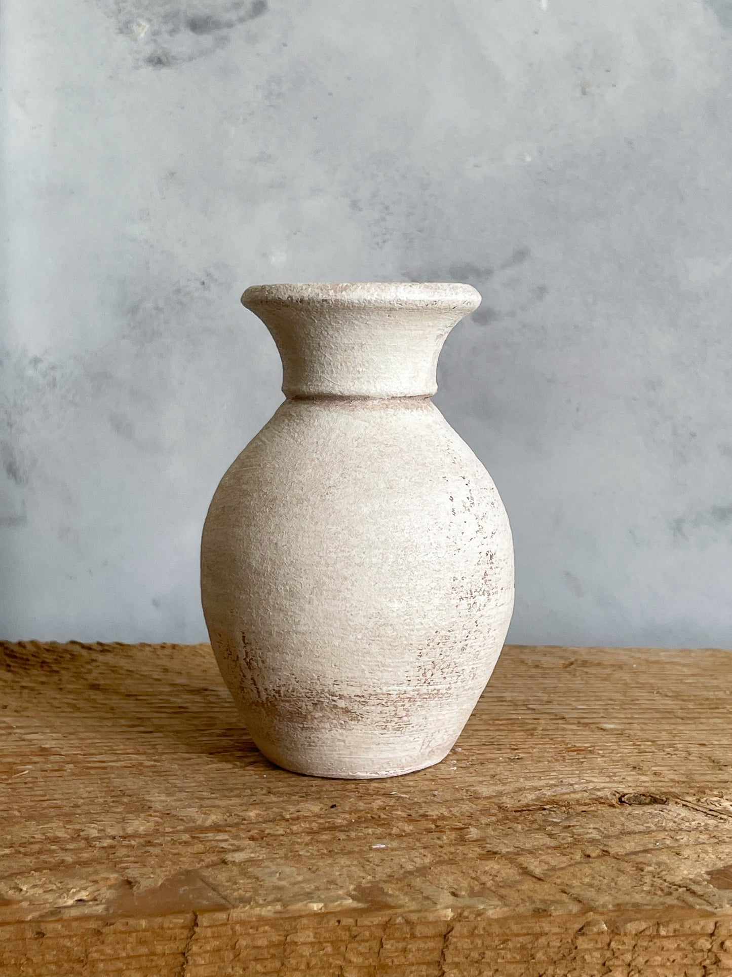 Close-up of hand-finished details on the mini vase.