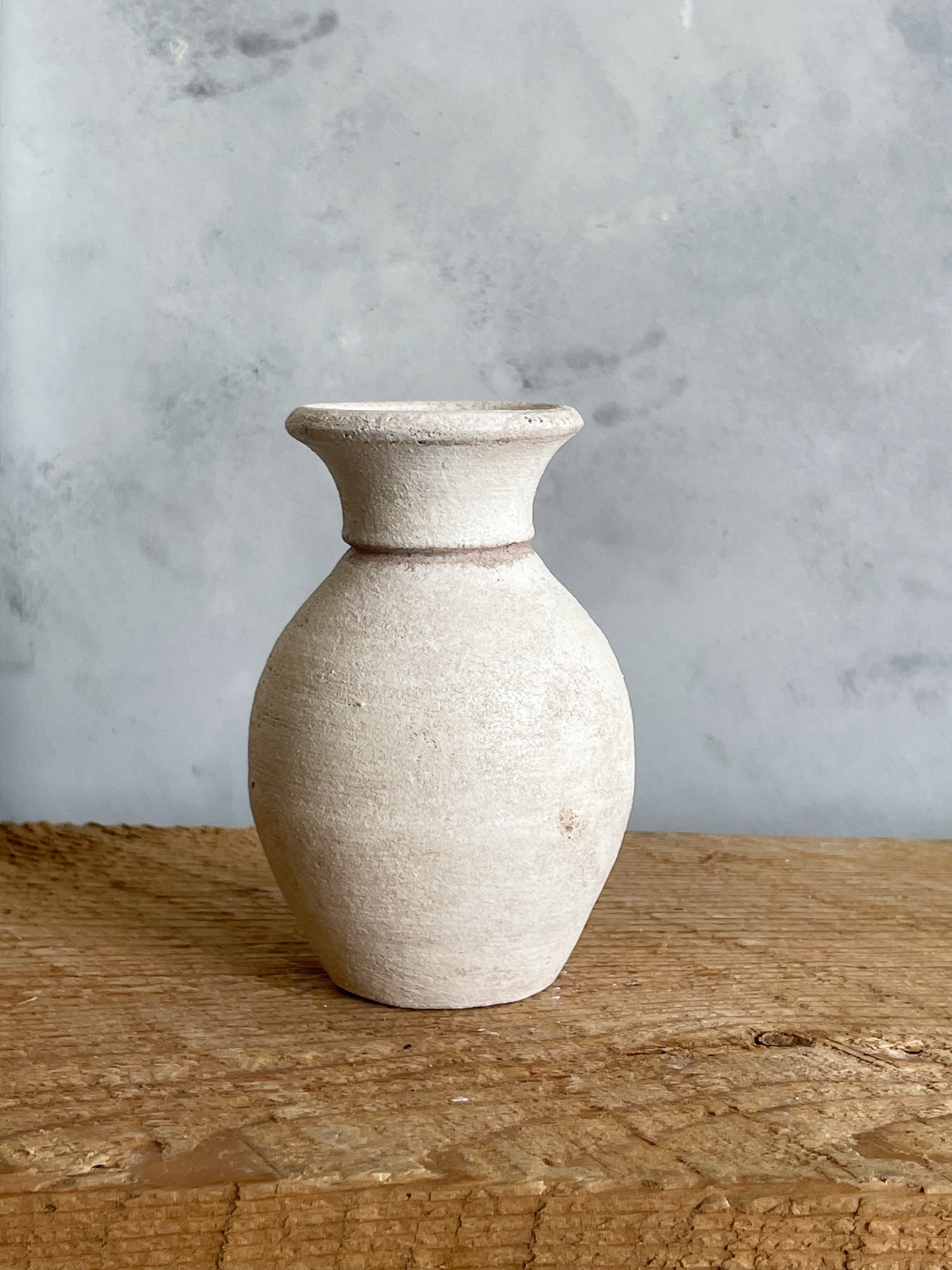 Close-up of hand-finished details on the mini vase.