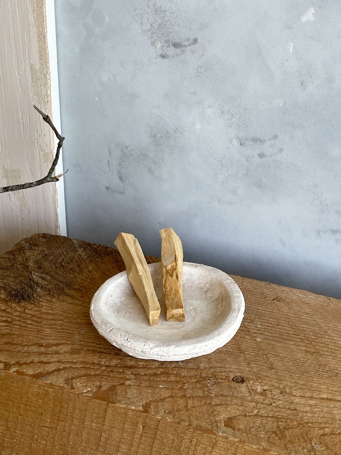 Angled view of the handmade cement decorative dish from the Milos Collection, showing its smooth, minimalist design and subtle textured finish.