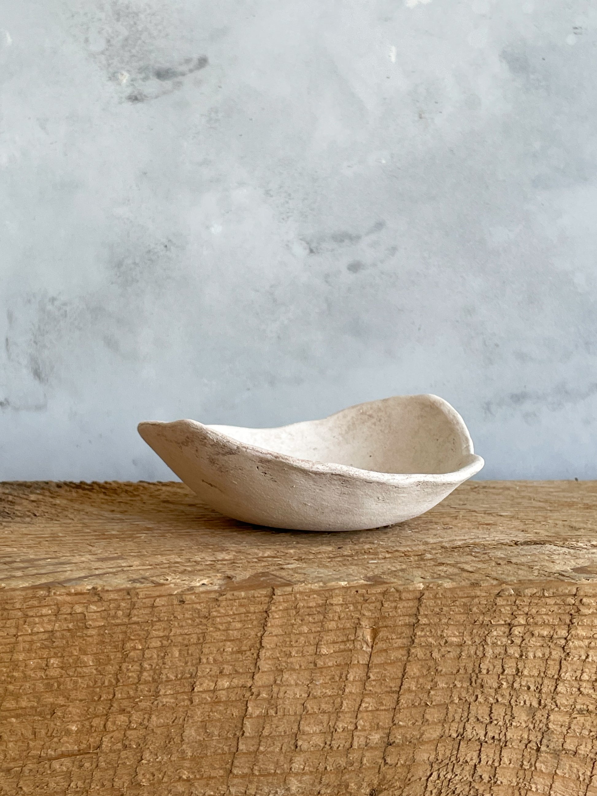 Close-up of the textured finish on the handmade ceramic rustic dish.