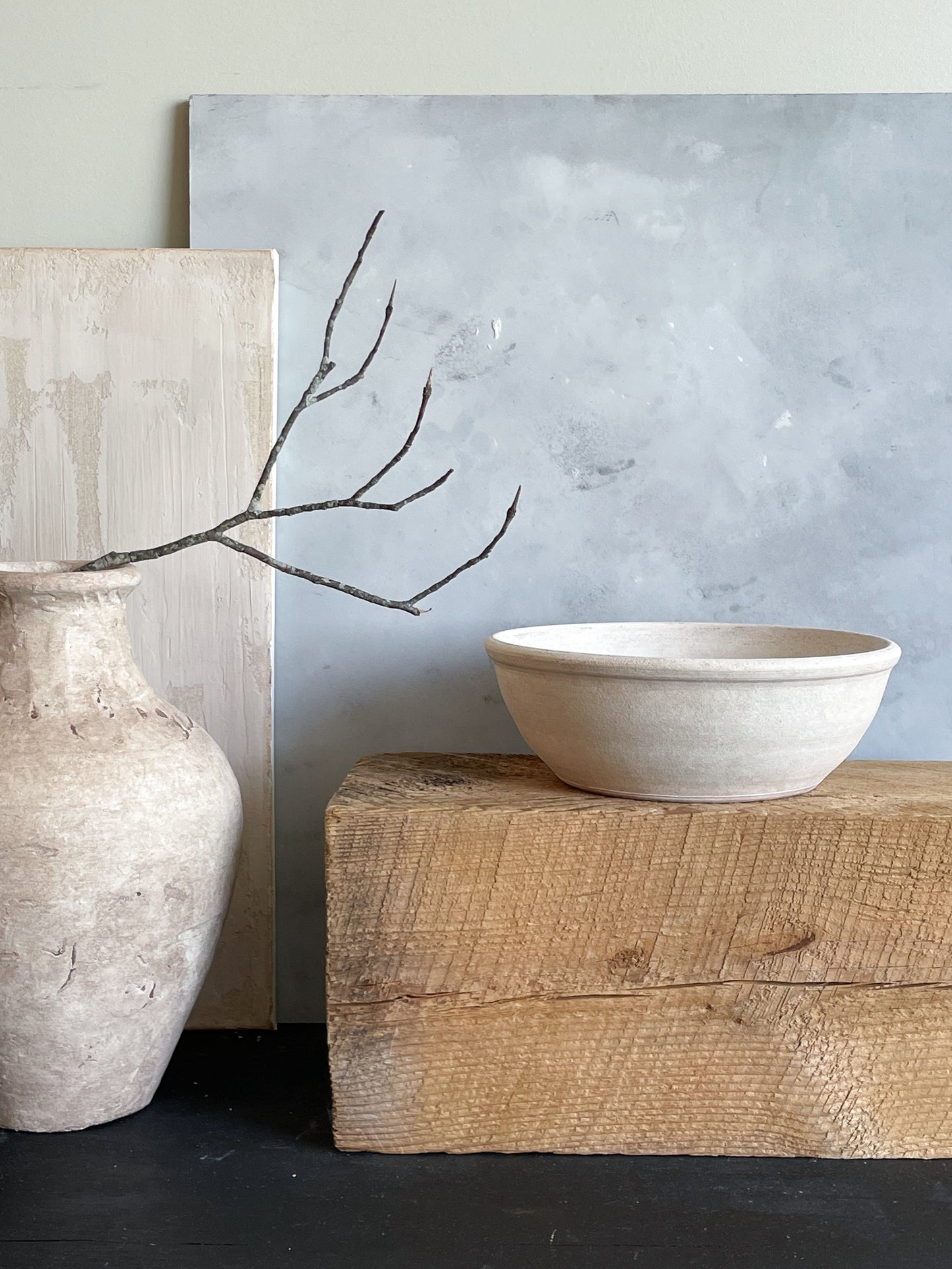 Earthy and neutral-toned interior setting featuring the aged white bowl.